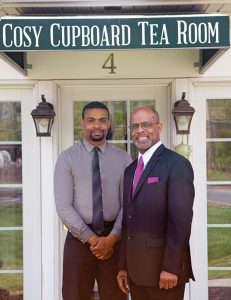 Professor James Howard (right) with his son Vincent, who serves as the Cosy Cupboard Tea Room's general manager.