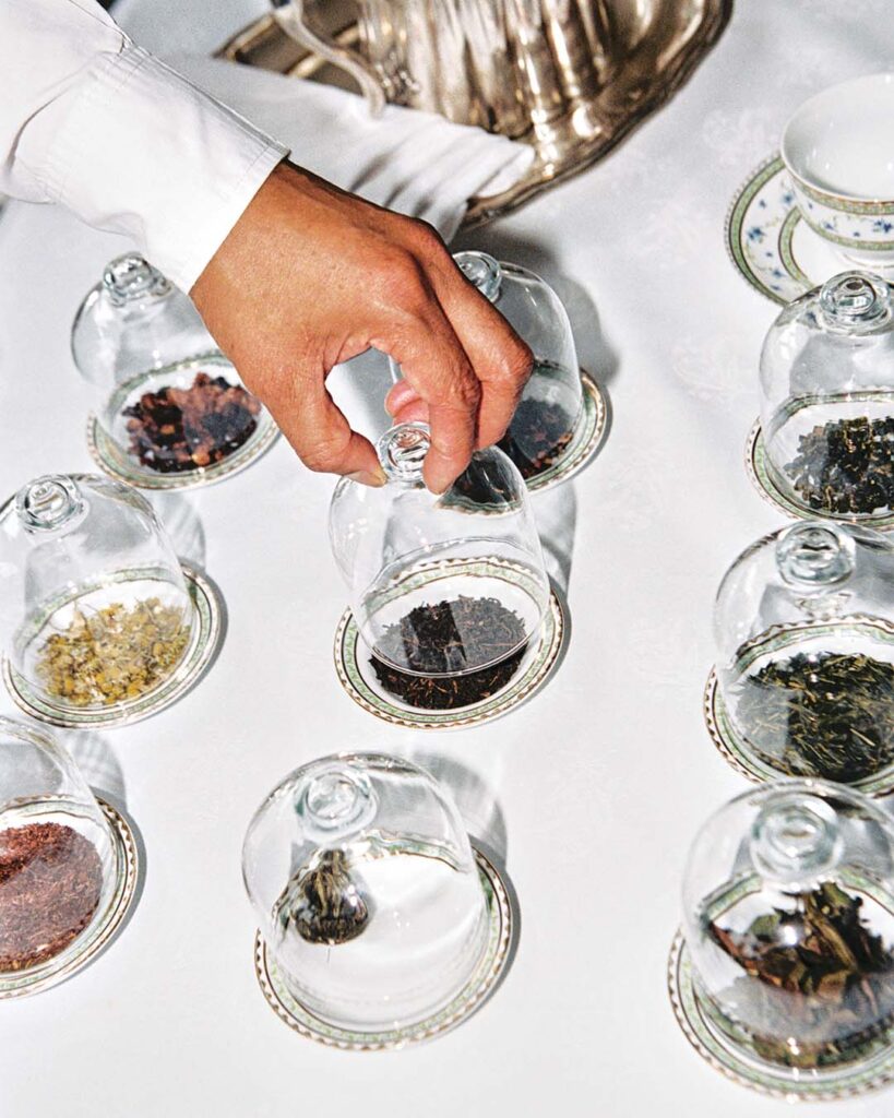 While discussing the various teas, Craig Cupido keeps them covered to preserve their delicate flavors and aromas.