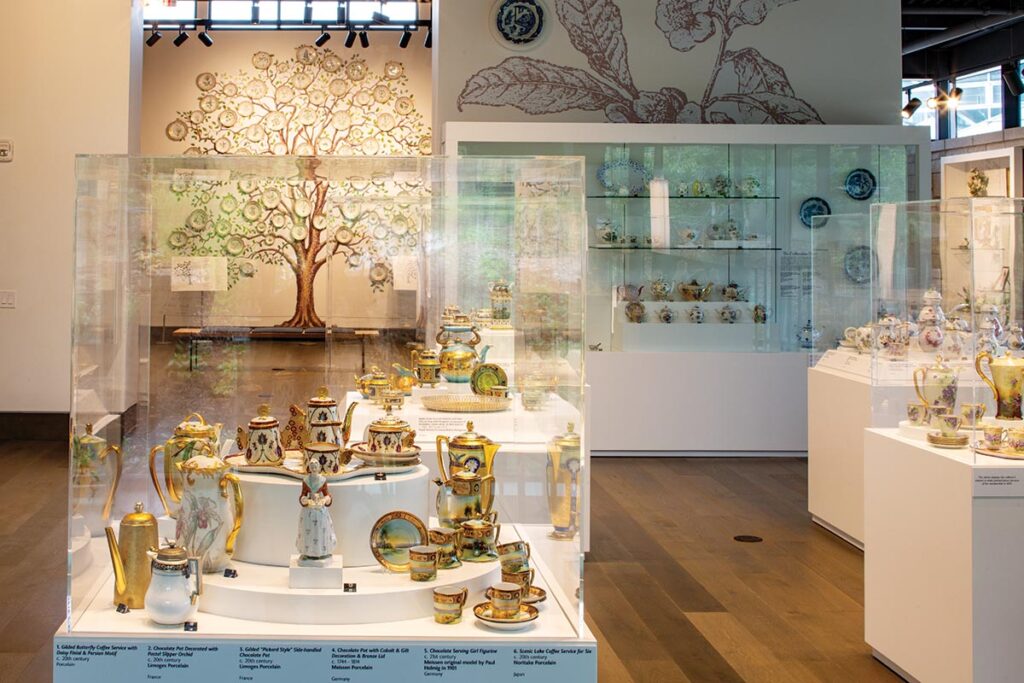 The Flora Danica “Tree of Life” is visible behind a case of coffee and chocolate services of French, German, and American provenance.