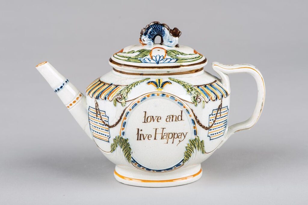 Circa 1805 Pratt-type pearlware teapot with relief molded decoration in classic Regency style.