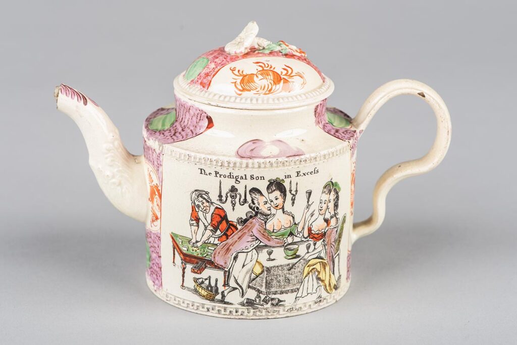 Circa 1780 creamware teapot with cartoon of “The Prodigal son in Excess,” probably by Leeds Pottery or Staffordshire potter William Greatbatch.