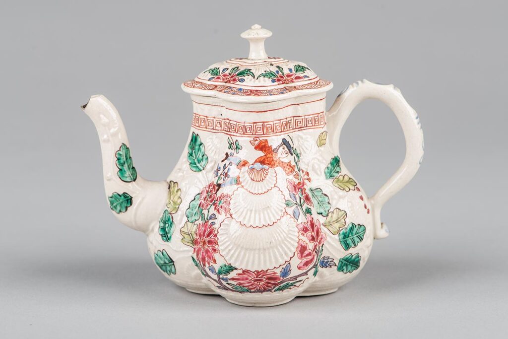 Salt-glazed stoneware teapot, probably by Wedgwood, painted with shells and a figure that is possibly Bonnie Prince Charlie, Stuart family claimant to the thrones of England, Scotland, and Ireland.