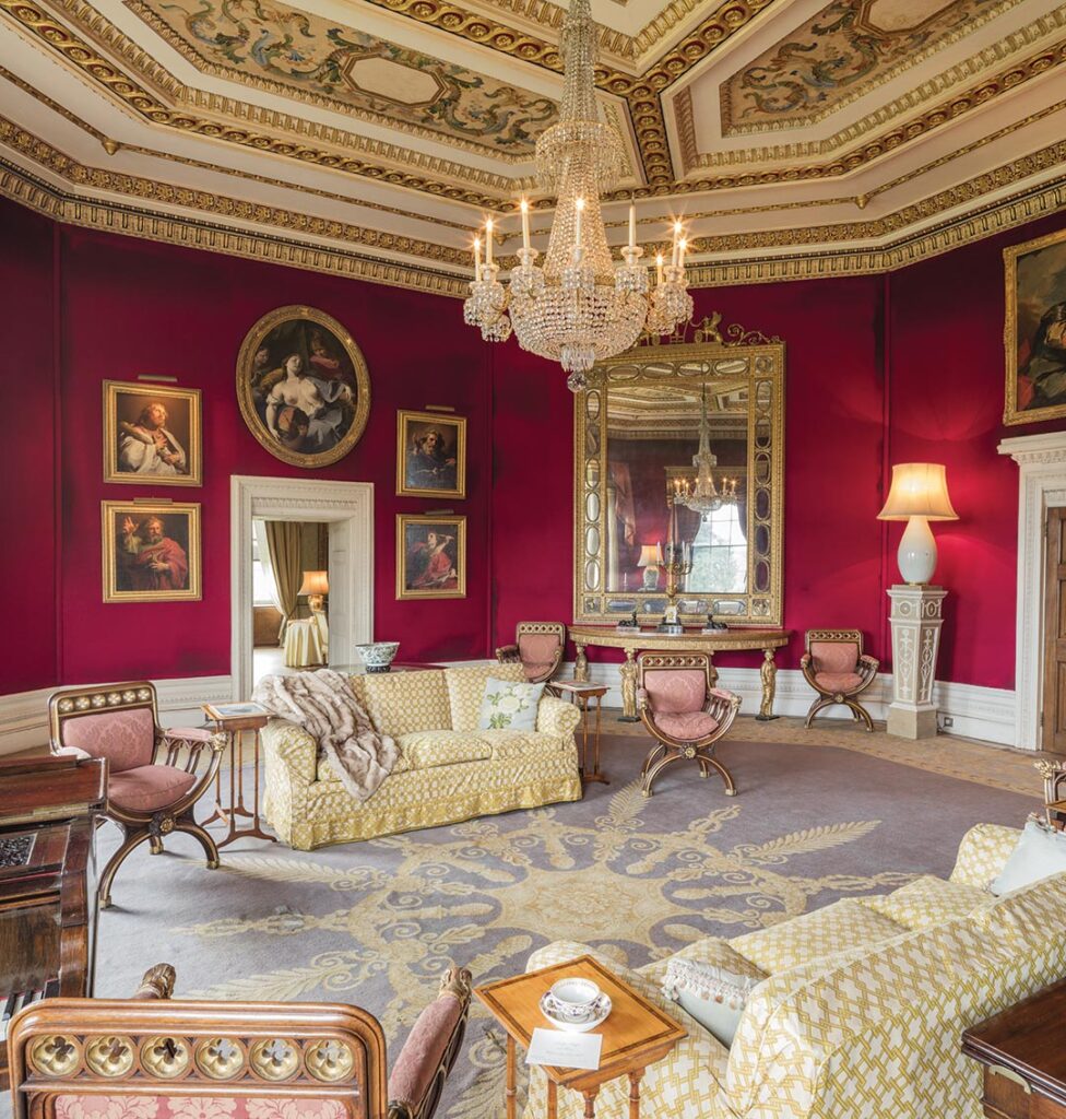 The walls of the Octagon Drawing Room were covered in red felt in 1954 by Lady Iliffe. The colour makes an excellent backdrop for paintings.