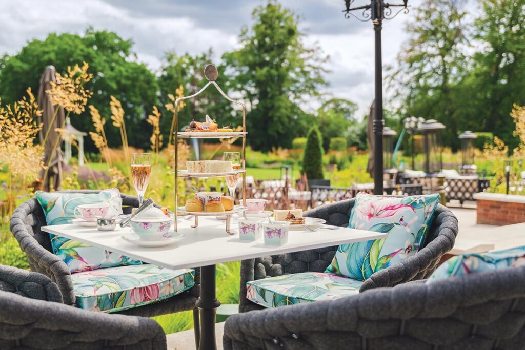 Afternoon tea is also served in the hotel garden on a sunny summer day. Photograph Courtesy of Fairmont Windsor Park