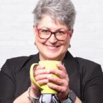 Kathleen_headshot with Green Mug Version 2