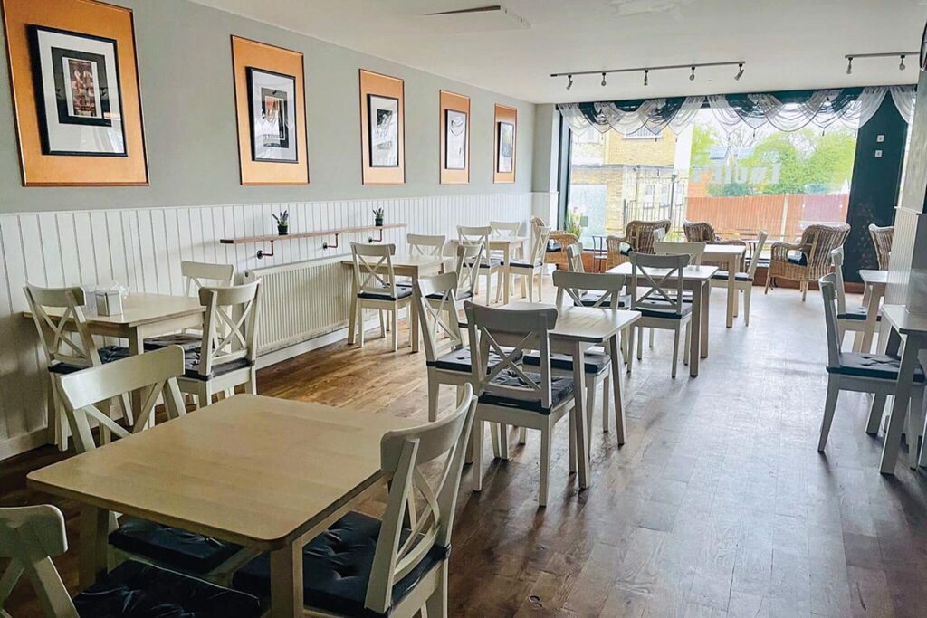 The light, airy simplicity of the furnishings appeals to all types of visitors. Photograph Courtesy of Louie’s Coffee & Teahouse