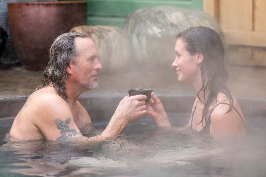 A couple enjoys tea in the hot-water pool.