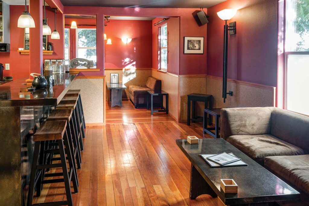 Sofas and cushioned banquettes furnish the serene tearoom. 